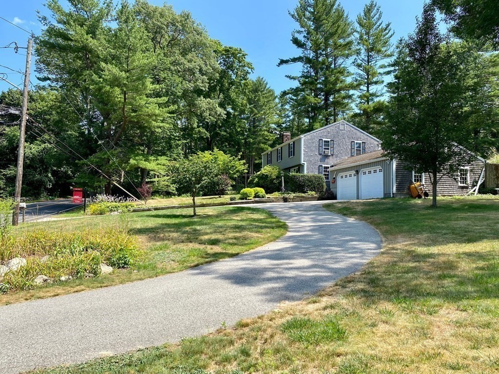 103 Clapp Road Scituate, MA 02066 - Photo 3 of 27 a view of a house with a big yard and large trees
