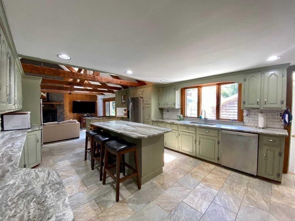 103 Clapp Road Scituate, MA 02066 - Photo 4 of 27 a kitchen with stainless steel appliances granite countertop a sink and cabinets