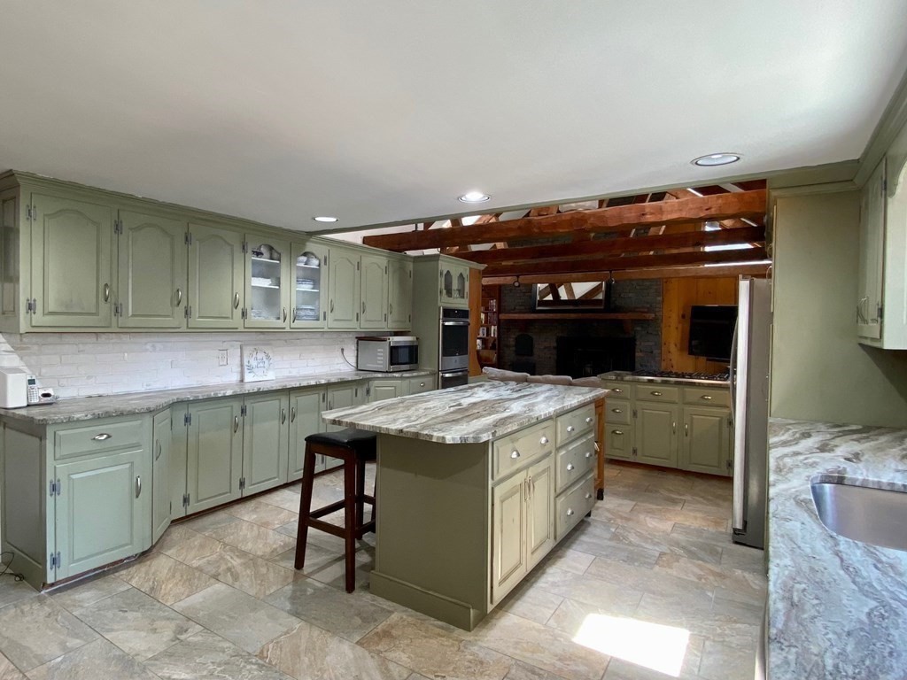 103 Clapp Road Scituate, MA 02066 - Photo 5 of 27 a kitchen with a stove and a sink