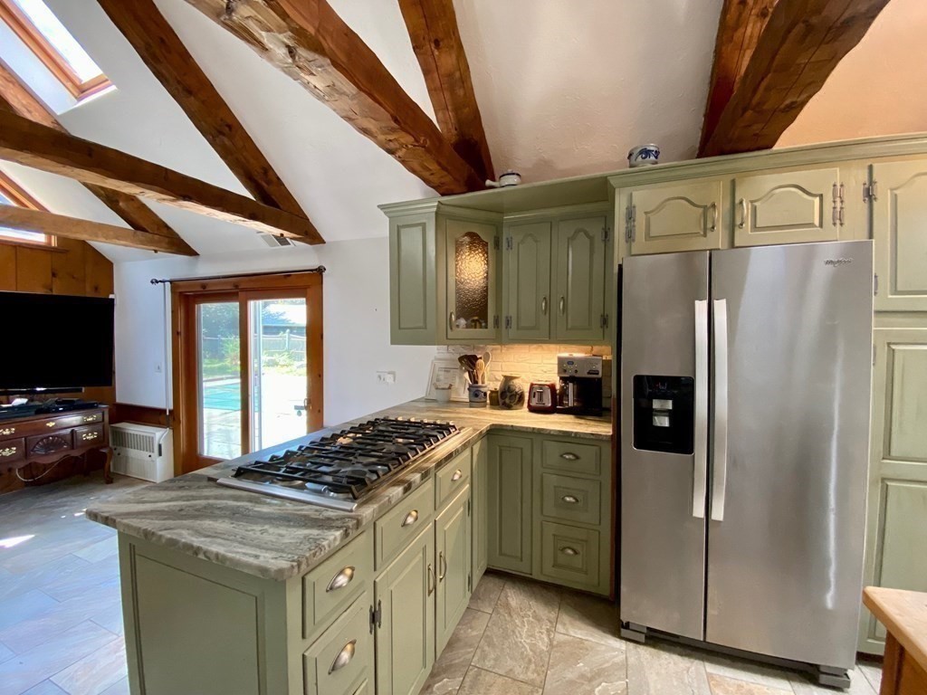 103 Clapp Road Scituate, MA 02066 - Photo 6 of 27 a kitchen with stainless steel appliances granite countertop a stove a sink dishwasher a refrigerator and a oven with wooden floor