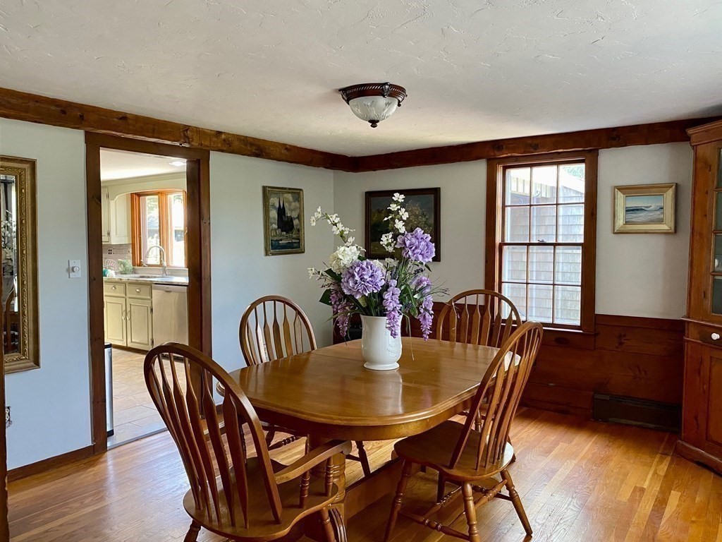 103 Clapp Road Scituate, MA 02066 - Photo 10 of 27 a view of a dining room with furniture window and wooden floor