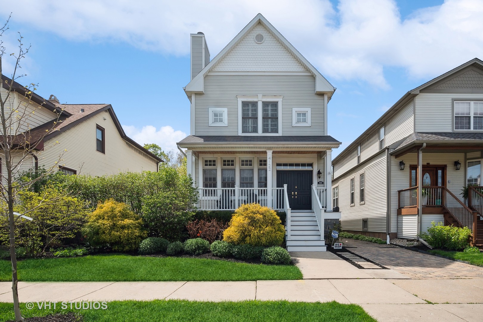 4122 North Kenneth Avenue Chicago, IL 60641 - Photo 1 of 27 a front view of a house with a garden and plants