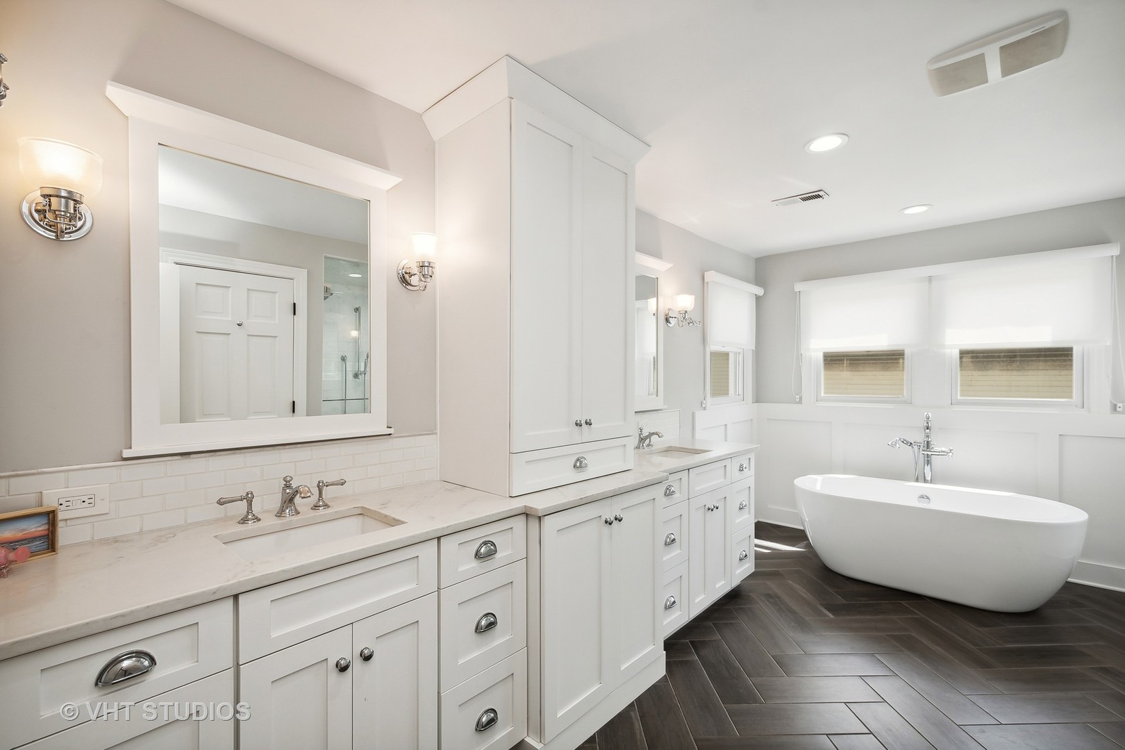 4122 North Kenneth Avenue Chicago, IL 60641 - Photo 12 of 27 a spacious bathroom with a double vanity sink mirror and bathtub
