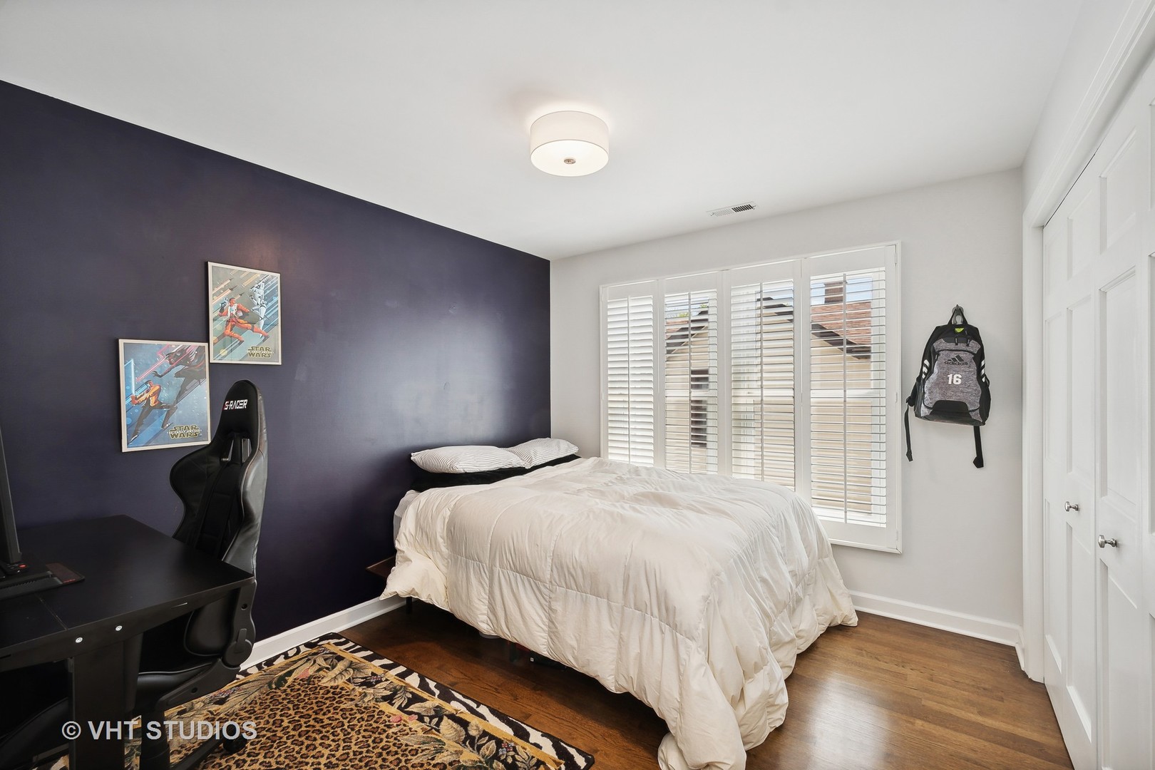 4122 North Kenneth Avenue Chicago, IL 60641 - Photo 15 of 27 a bedroom with a bed and a large window