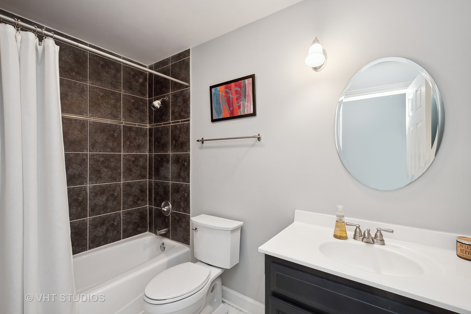 4122 North Kenneth Avenue Chicago, IL 60641 - Photo 18 of 27 a bathroom with a sink toilet and shower