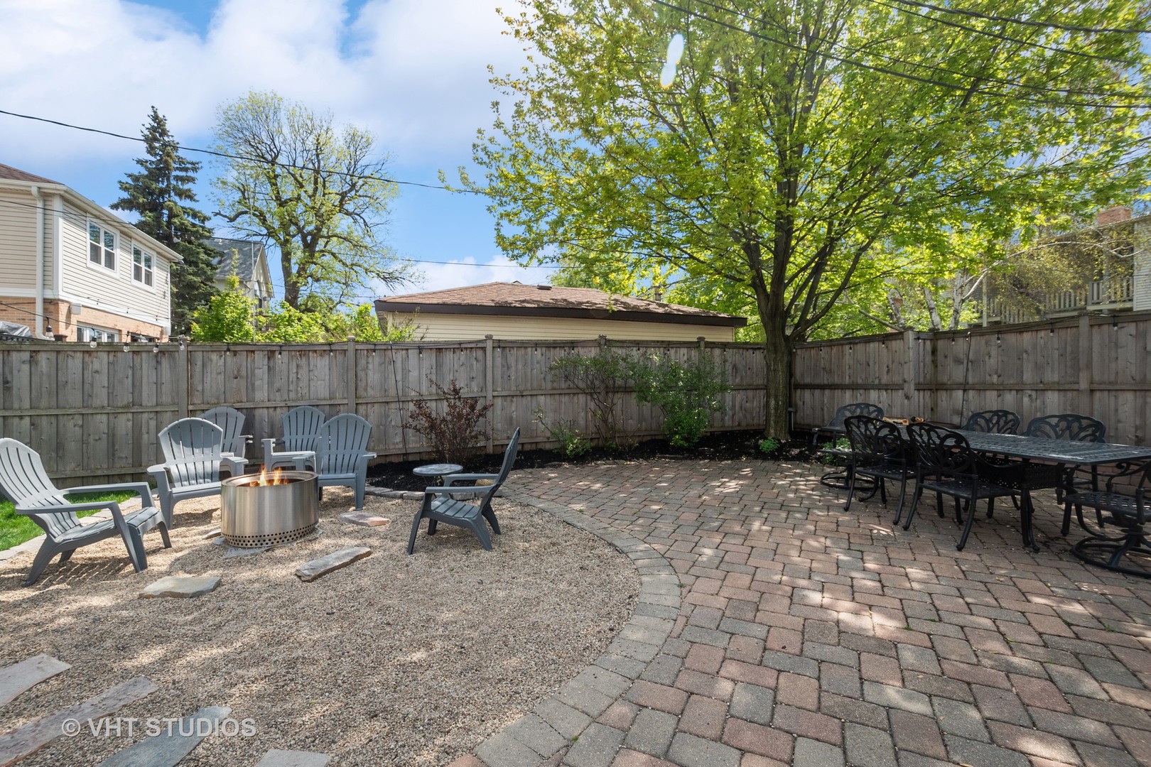 4122 North Kenneth Avenue Chicago, IL 60641 - Photo 23 of 27 a view of backyard with table and chairs and a large tree