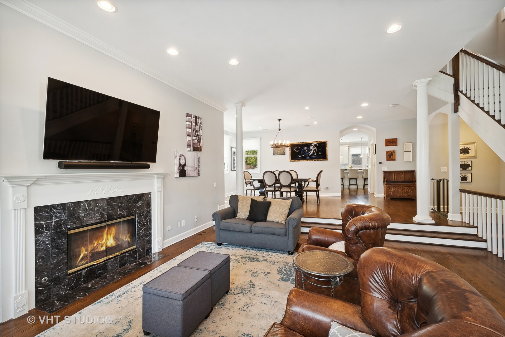 4122 North Kenneth Avenue Chicago, IL 60641 - Photo 3 of 27 a living room with furniture a fireplace and a flat screen tv