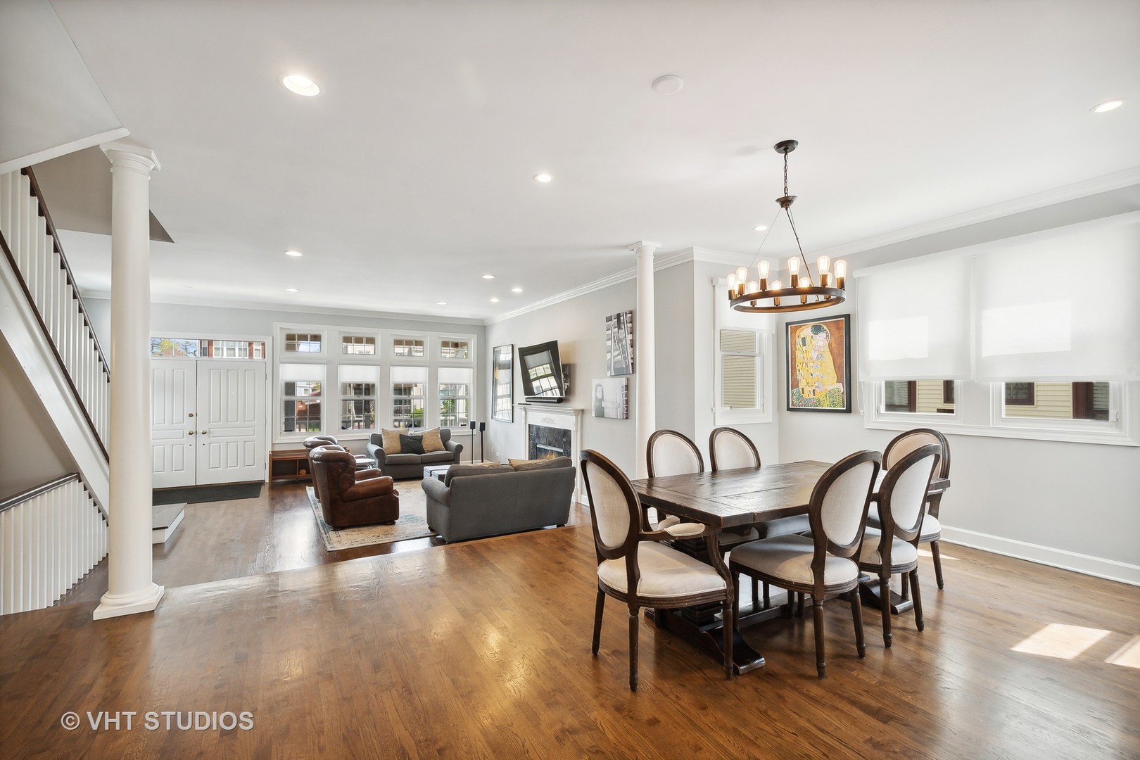 4122 North Kenneth Avenue Chicago, IL 60641 - Photo 6 of 27 a view of a dining room with furniture wooden floor and chandelier