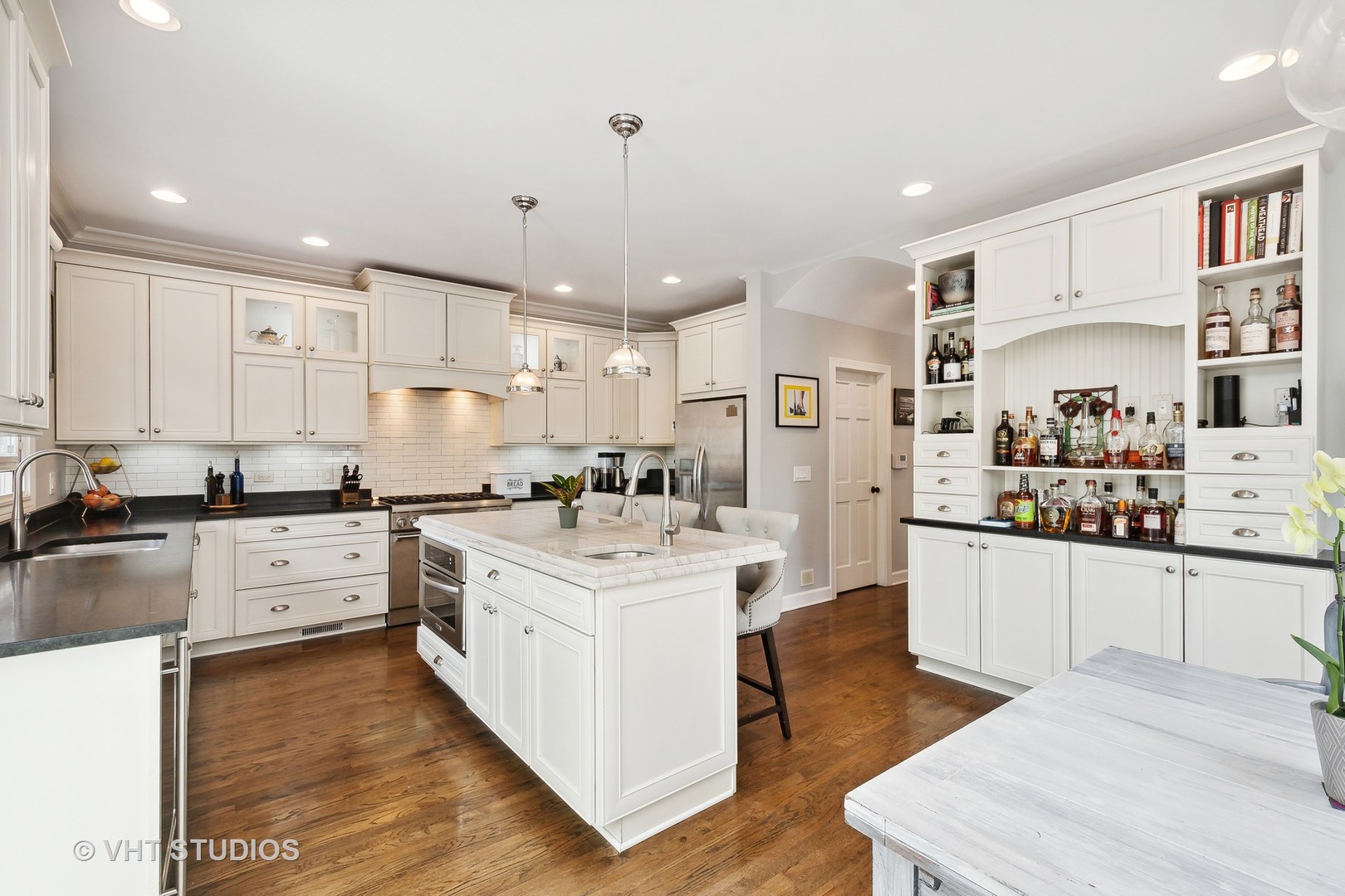 4122 North Kenneth Avenue Chicago, IL 60641 - Photo 7 of 27 a kitchen with white cabinets and white appliances