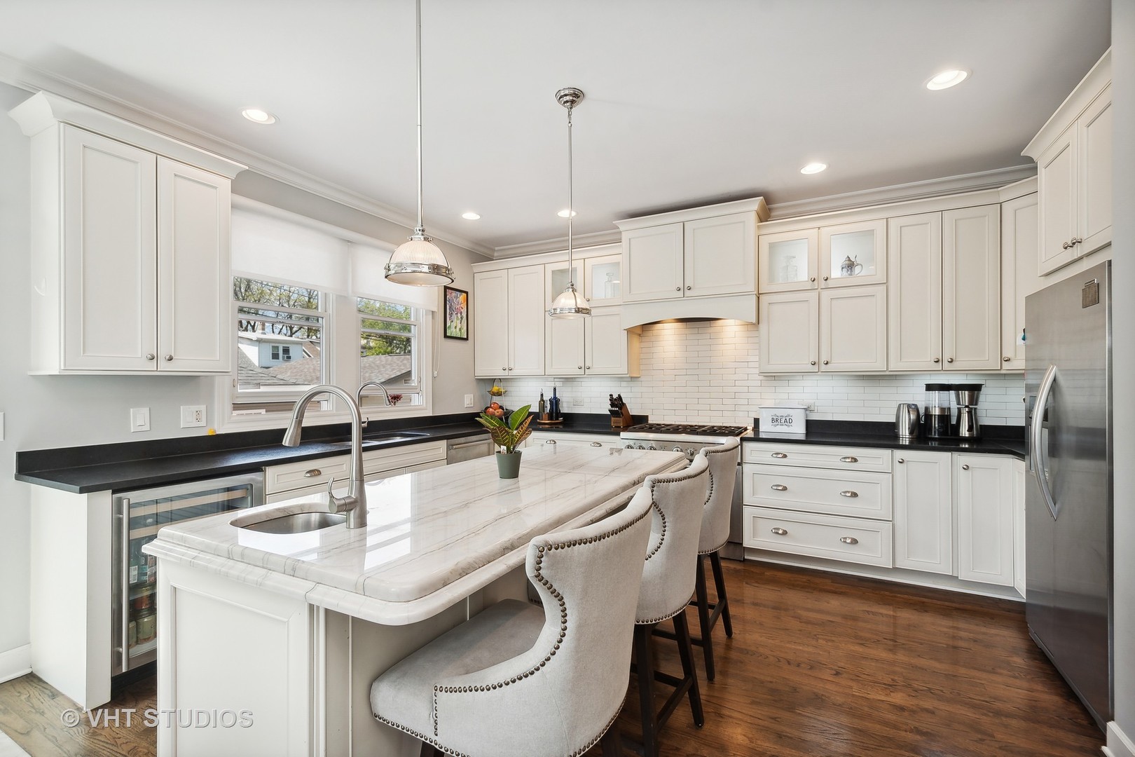 4122 North Kenneth Avenue Chicago, IL 60641 - Photo 8 of 27 a kitchen with stainless steel appliances granite countertop a sink a stove a refrigerator and white cabinets