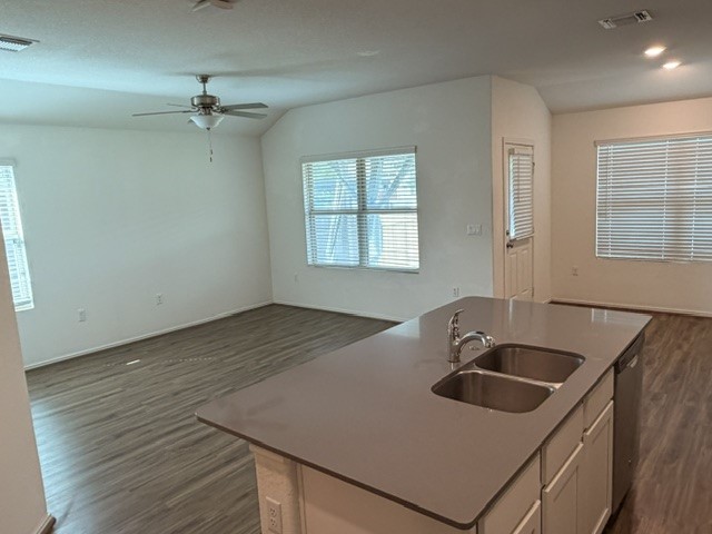 6917 Colorado Bluffs Road Austin, TX 78744 - Photo 19 of 19 a kitchen with a sink and a stove