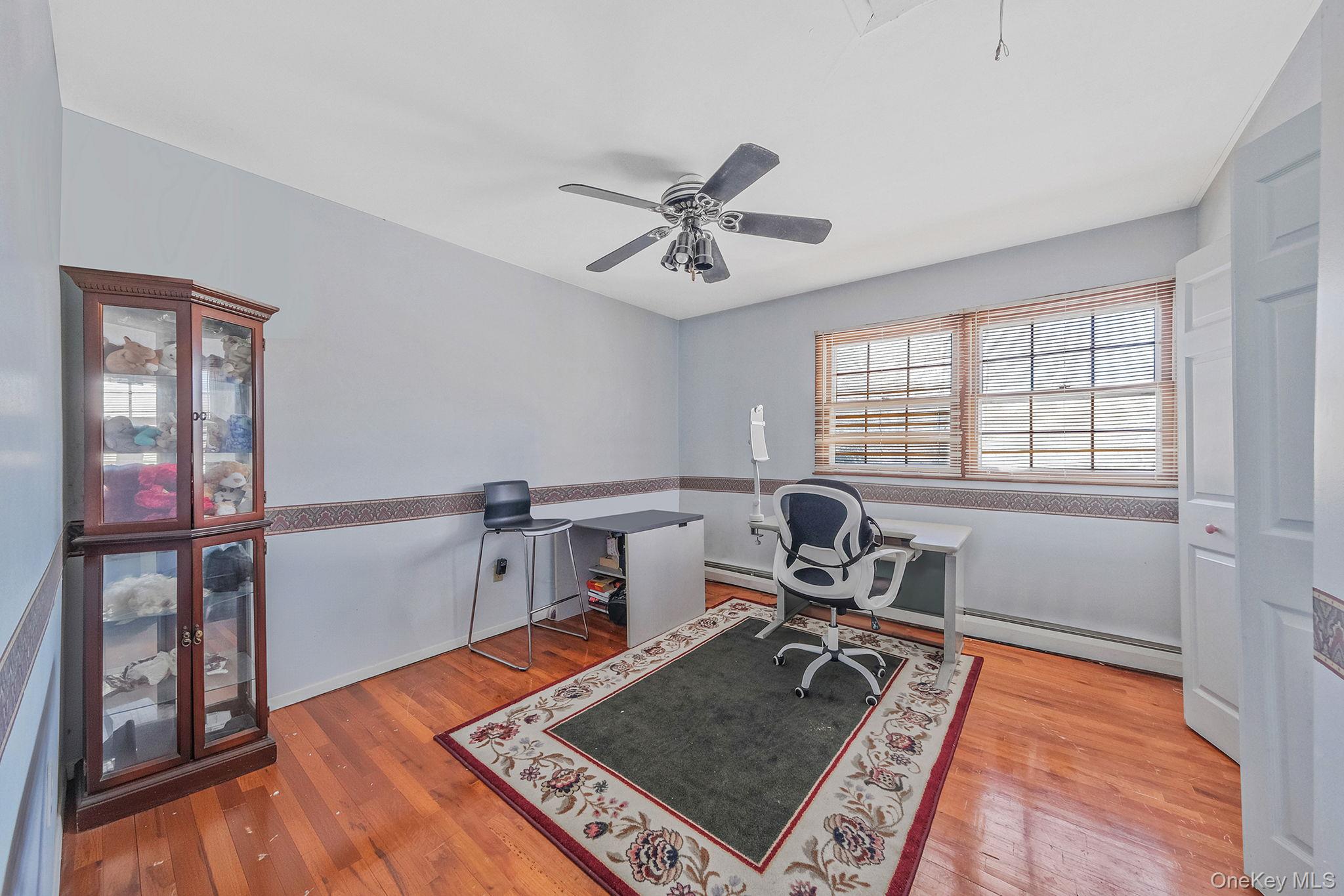 140 Seaman Neck Road Dix Hills, NY 11746 - Photo 11 of 21 a room with furniture and wooden floor