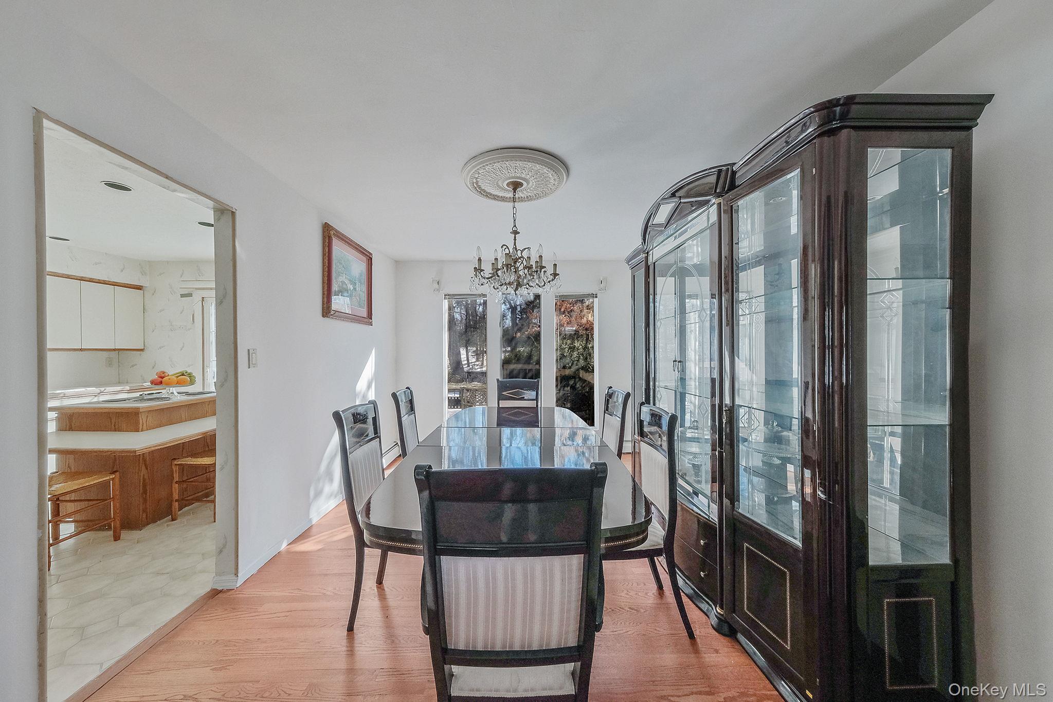 140 Seaman Neck Road Dix Hills, NY 11746 - Photo 4 of 21 a view of a dining room with furniture window and wooden floor