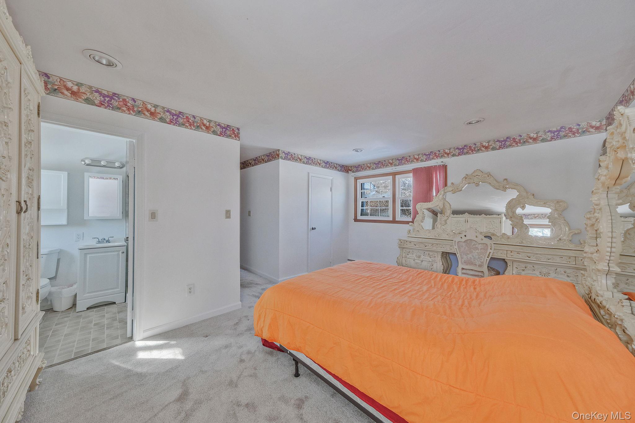 140 Seaman Neck Road Dix Hills, NY 11746 - Photo 9 of 21 a bathroom with a bathtub and shower