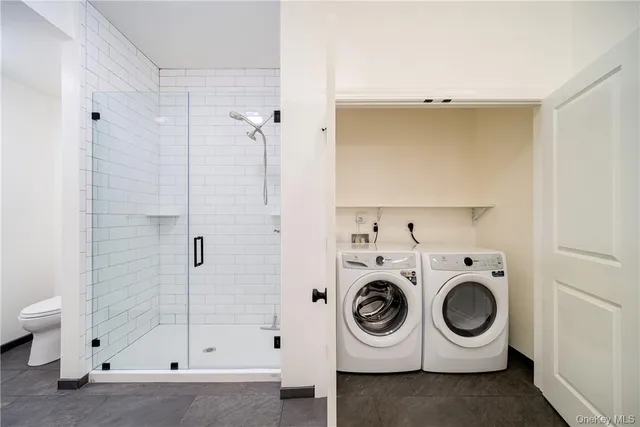 a utility room with dryer and washer