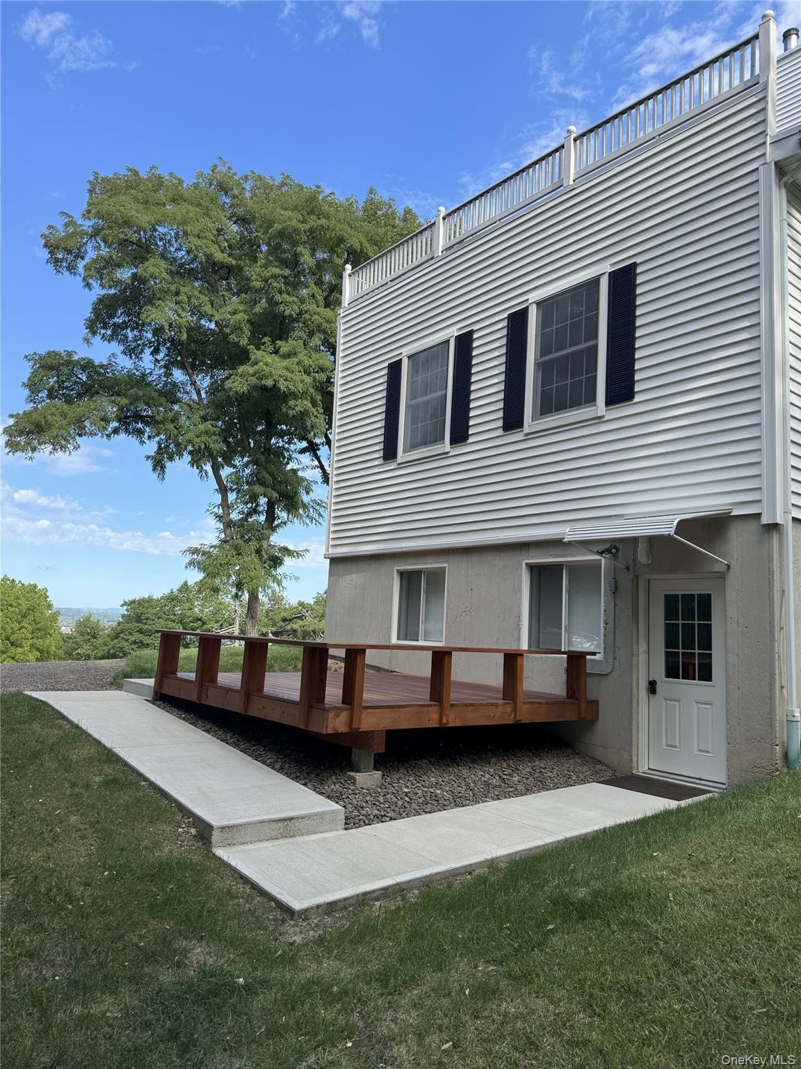 22 Lapis Drive, Unit B Beacon, NY 12508 - Photo 2 of 23 a front view of a house with a garden