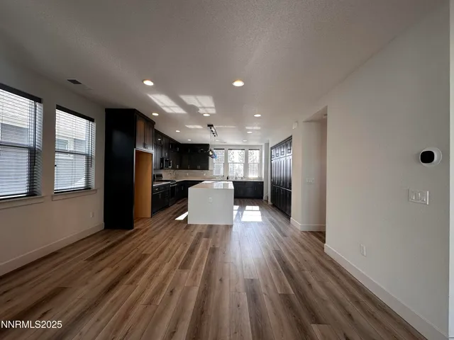 a view of kitchen with cabinets
