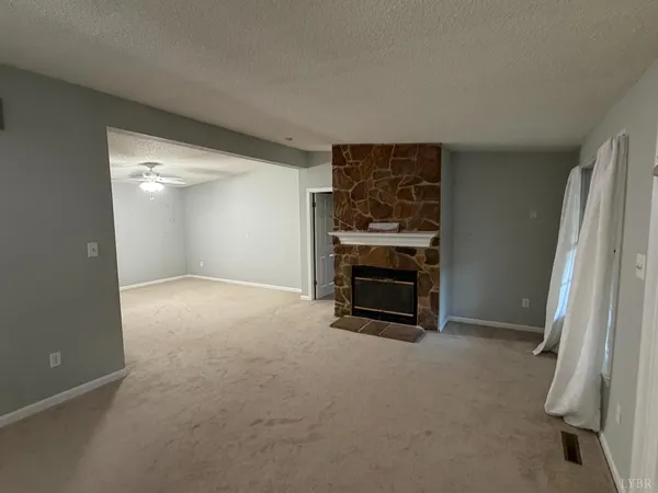 a kitchen with refrigerator and cabinets
