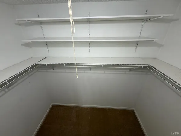 a view of a hallway with stairs