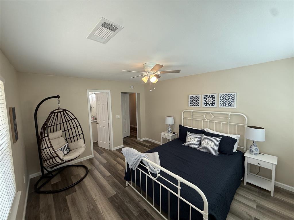 217 Comanche Trail Nocona, TX 76255 - Photo 13 of 13 a bedroom with a bed and wooden floor