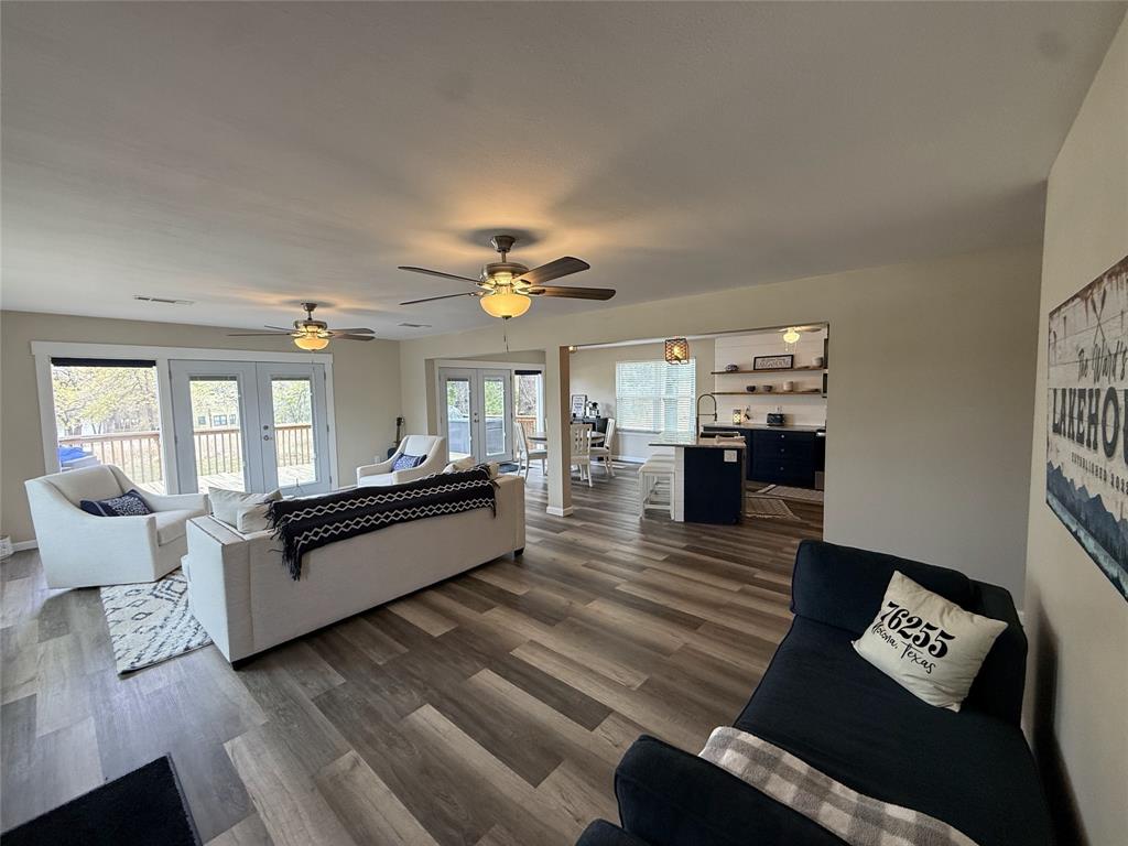 217 Comanche Trail Nocona, TX 76255 - Photo 3 of 13 a living room with furniture and a chandelier