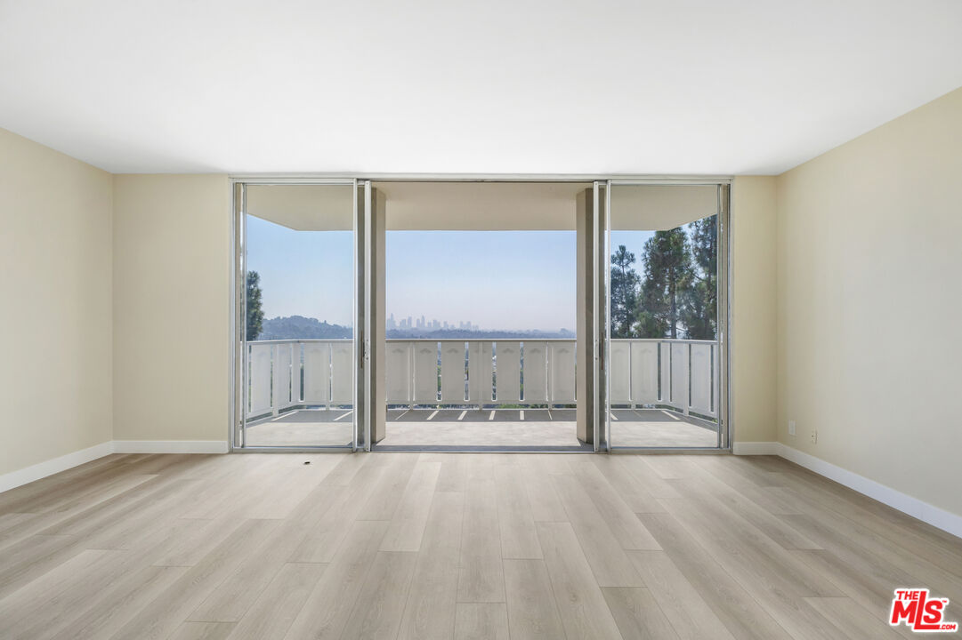 4455 Los Feliz Boulevard, Unit 1005 Los Angeles, CA 90027 - Photo 3 of 17 a view of an empty room with glass door