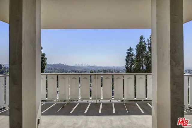 a view of balcony with furniture