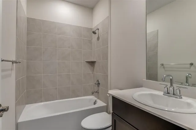 a bathroom with a sink toilet and bathtub