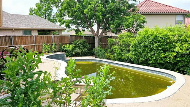 a view of a swimming pool with a garden