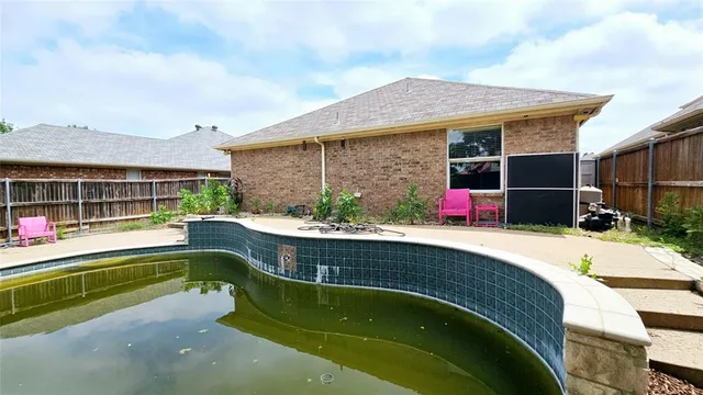 a house view with swimming pool and porch