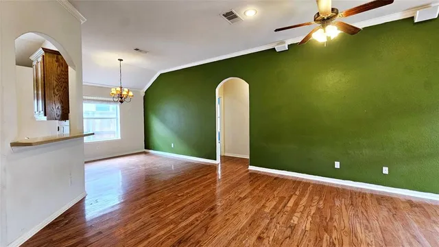 a view of a livingroom with wooden floor
