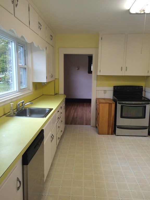 25 Argilla Road Ipswich, MA 01938 - Photo 12 of 20 a kitchen with a sink and a stove top oven
