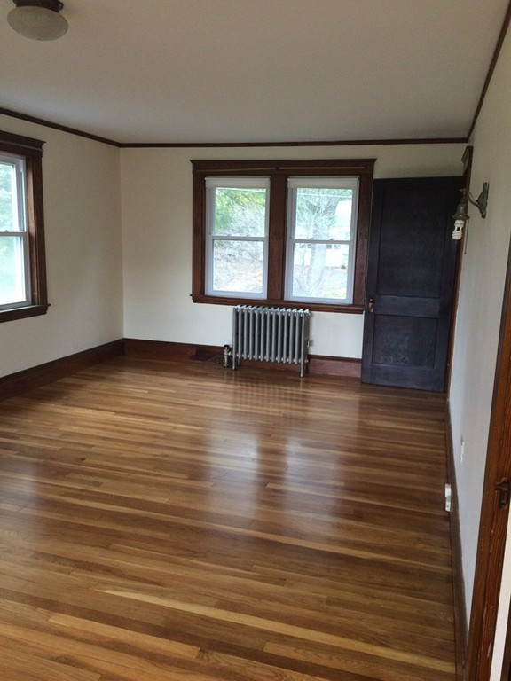 25 Argilla Road Ipswich, MA 01938 - Photo 17 of 20 a view of an empty room with wooden floor and a window