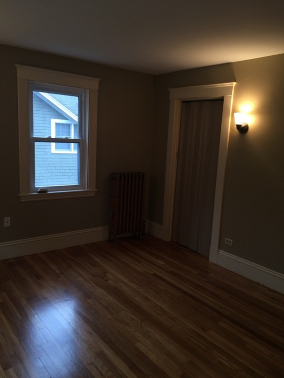 25 Argilla Road Ipswich, MA 01938 - Photo 18 of 20 an empty room with wooden floor and windows