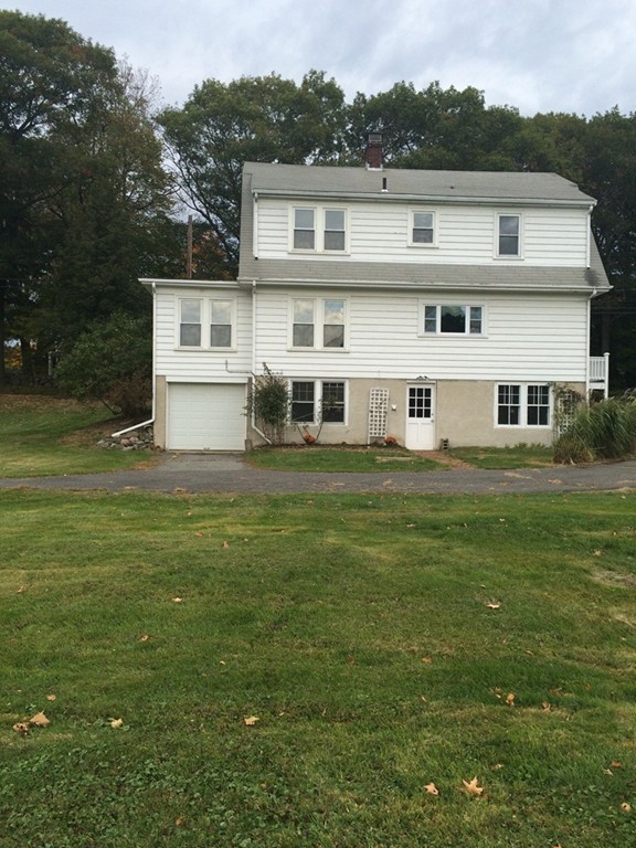 25 Argilla Road Ipswich, MA 01938 - Photo 2 of 20 a front view of house with yard and trees in the background