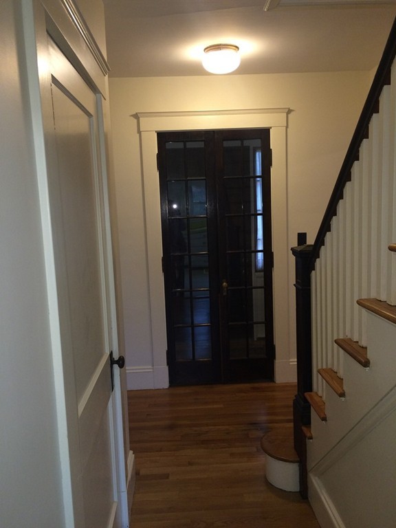 25 Argilla Road Ipswich, MA 01938 - Photo 5 of 20 a view of a hallway with wooden floor and staircase