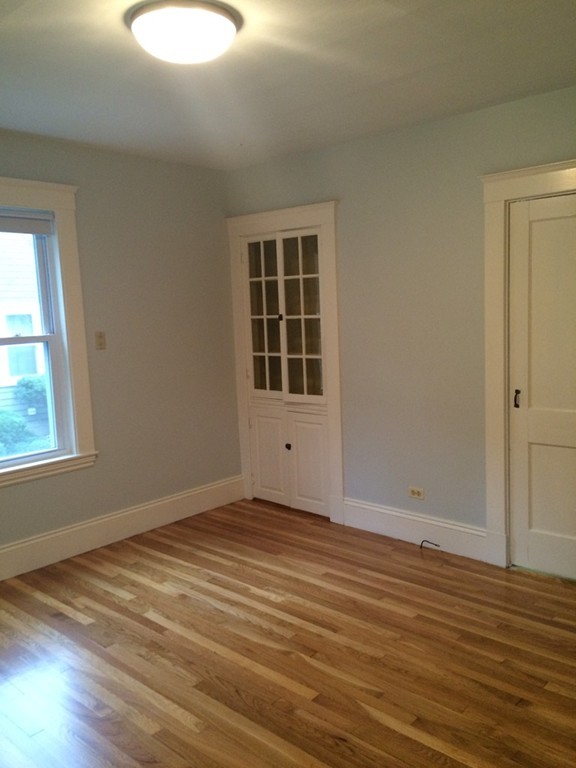 25 Argilla Road Ipswich, MA 01938 - Photo 7 of 20 a view of an empty room with wooden floor and a window