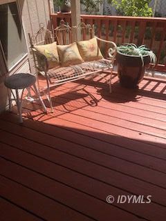 18 Pine Cove Road Idyllwild, CA 92549 - Photo 14 of 14 a view of a roof deck with couches and wooden floor