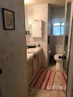 18 Pine Cove Road Idyllwild, CA 92549 - Photo 4 of 14 a bathroom with a sink toilet and mirror