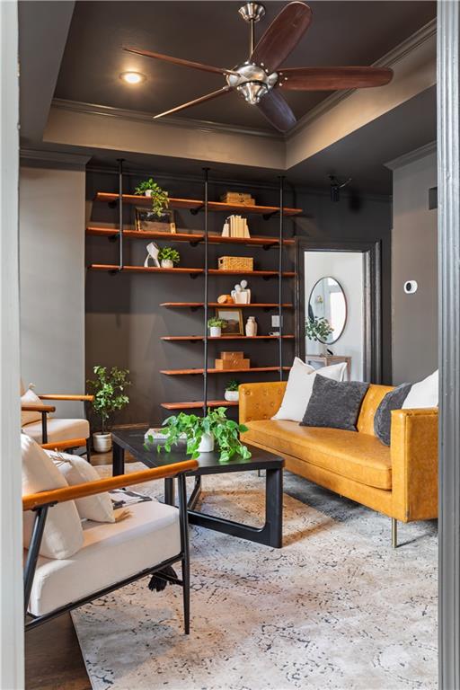 679 Lawton Street Southwest Atlanta, GA 30310 - Photo 12 of 45 a living room with furniture a chandelier and a wooden floor