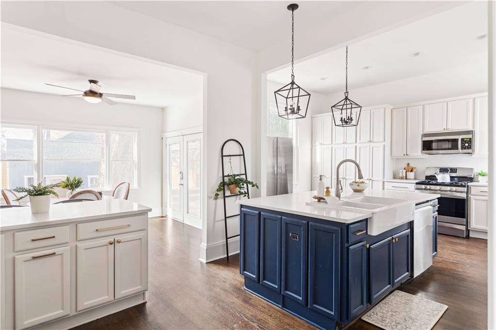 679 Lawton Street Southwest Atlanta, GA 30310 - Photo 15 of 45 a kitchen with sink stove and cabinets