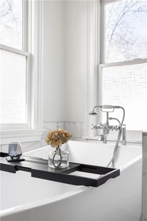 679 Lawton Street Southwest Atlanta, GA 30310 - Photo 26 of 45 a bathroom with a granite countertop sink and a mirror