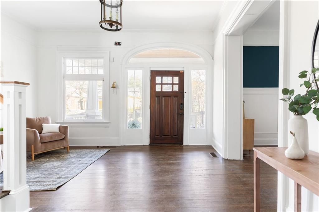 679 Lawton Street Southwest Atlanta, GA 30310 - Photo 3 of 45 a view of livingroom with furniture wooden floor and windows