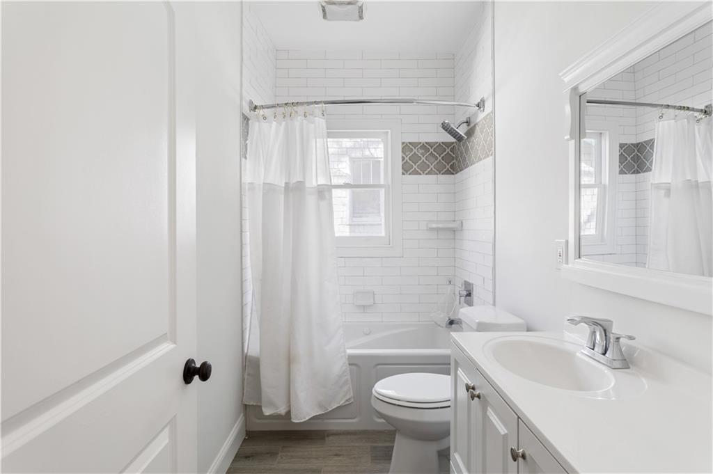 679 Lawton Street Southwest Atlanta, GA 30310 - Photo 31 of 45 a bathroom with a sink toilet and shower
