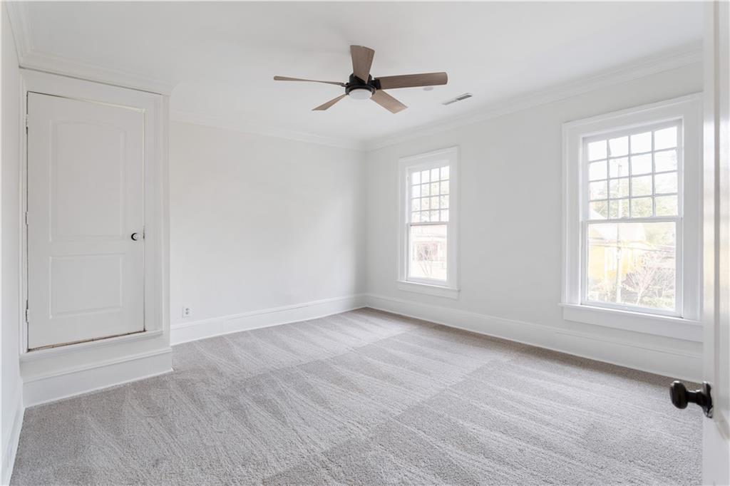 679 Lawton Street Southwest Atlanta, GA 30310 - Photo 32 of 45 wooden floor in an empty room with a window