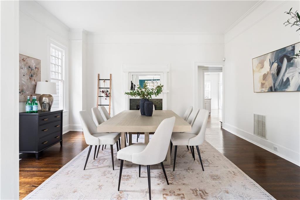 679 Lawton Street Southwest Atlanta, GA 30310 - Photo 9 of 45 a view of a dining room with furniture window and wooden floor