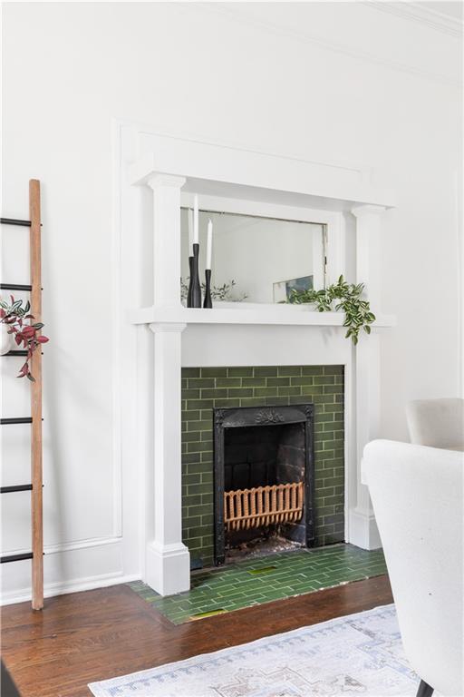 679 Lawton Street Southwest Atlanta, GA 30310 - Photo 10 of 45 a living room with a fireplace and a couch