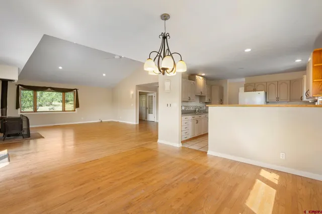 a kitchen that has a sink cabinets counter space and appliances
