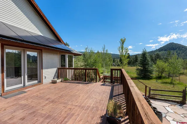 a view of a balcony with two chairs