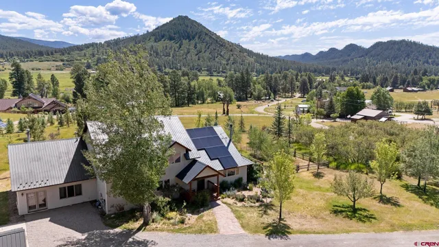 a view of a house with basketball court